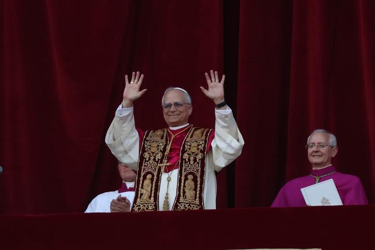 Pope Leo greets the faithful after his election on May 8, 2025.