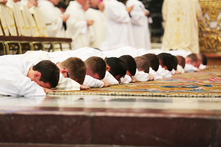 Ordinandi lie prostrate during the Litany of Saints during an ordination Mass in St. Peter’s Basilica on Sept. 29, 2016.