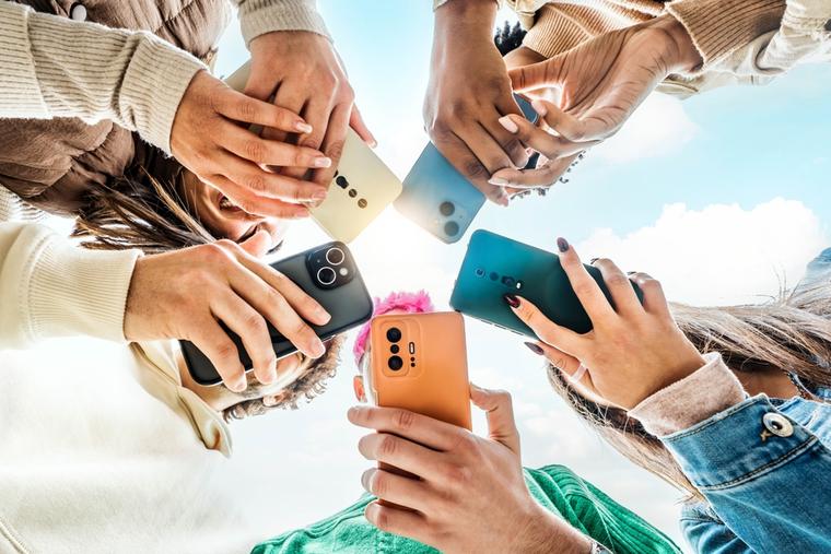 Teens on smartphones.