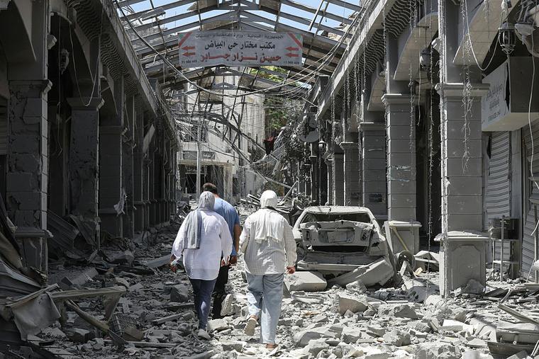 People make their way through the heavily damaged historic market of Nabatieh as residents displaced by the fighting return to southern Lebanon on June 15, 2026. Israel's defence minister said on June 15, that Israeli forces would remain in Lebanon, Syria and Gaza indefinitely, hours after the United States and Iran agreed to end the Middle East war, including in Lebanon.