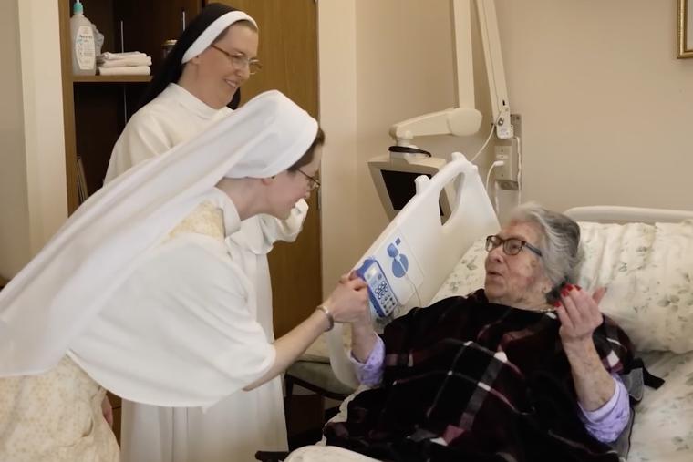 Dominican Sisters of Hawthorne spend time with a resident at Rosary Hill Home in Hawthorne, New York.