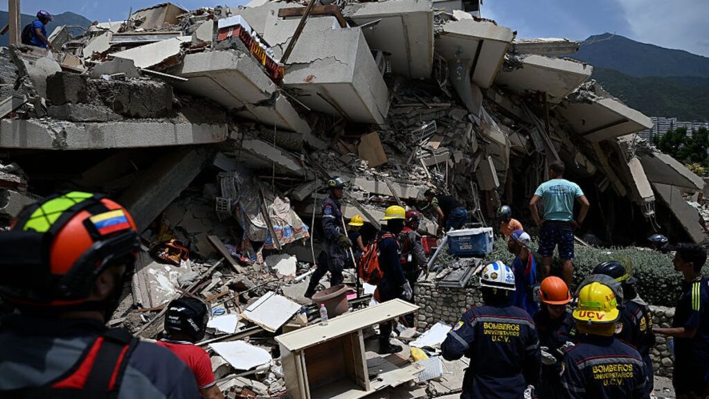 Rescuers Pull Dog From Rubble As Earthquake Death Toll Rises