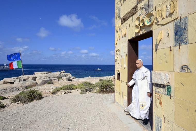 Pope Leo XIV walks through the Porta d’Europa (Gateway to Europe) monument on the Italian island of Lampedusa on July 4, 2026.