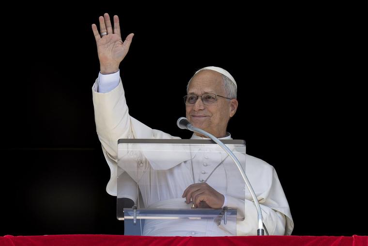 Pope Leo XIV greets the crowd gathered in St. Peter's Square for his Angelus address Sept. 13.