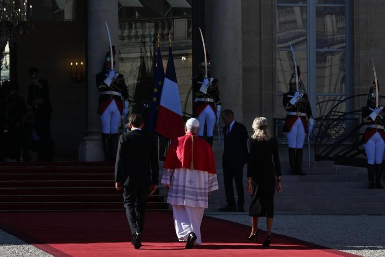 Pope Leo XIV walks with the president of France, Emmanuel Macron, and the first lady of France, Brigitte Macron, at the Élysée Palace in Paris on Sept. 25, 2026.